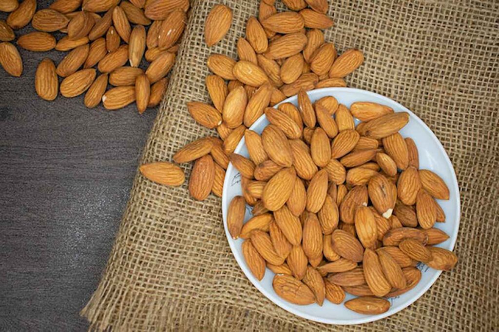 In what ways may eating almonds help people with diabetes